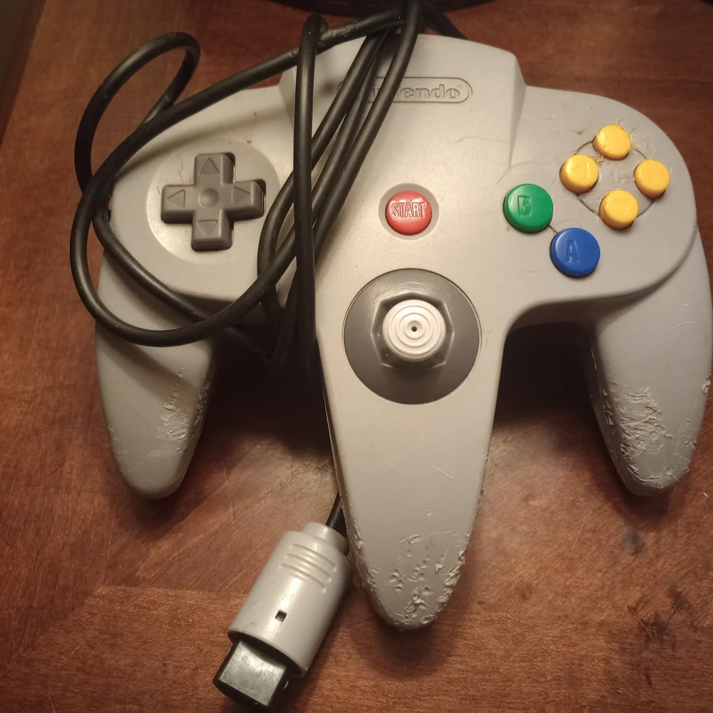 Gray and Pink Video Game Controllers